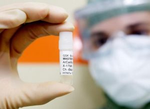 Handout photo shows technician holding a master H1N1 virus sample for the pre-production of vaccine at  laboratory in Dresden